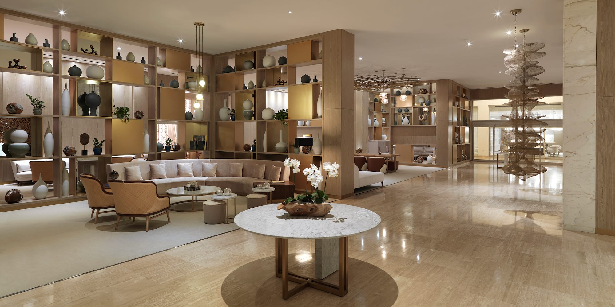 a room with a large white table and chairs