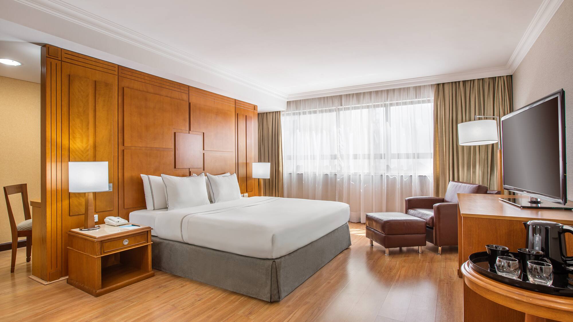 a room with a bed and a chair