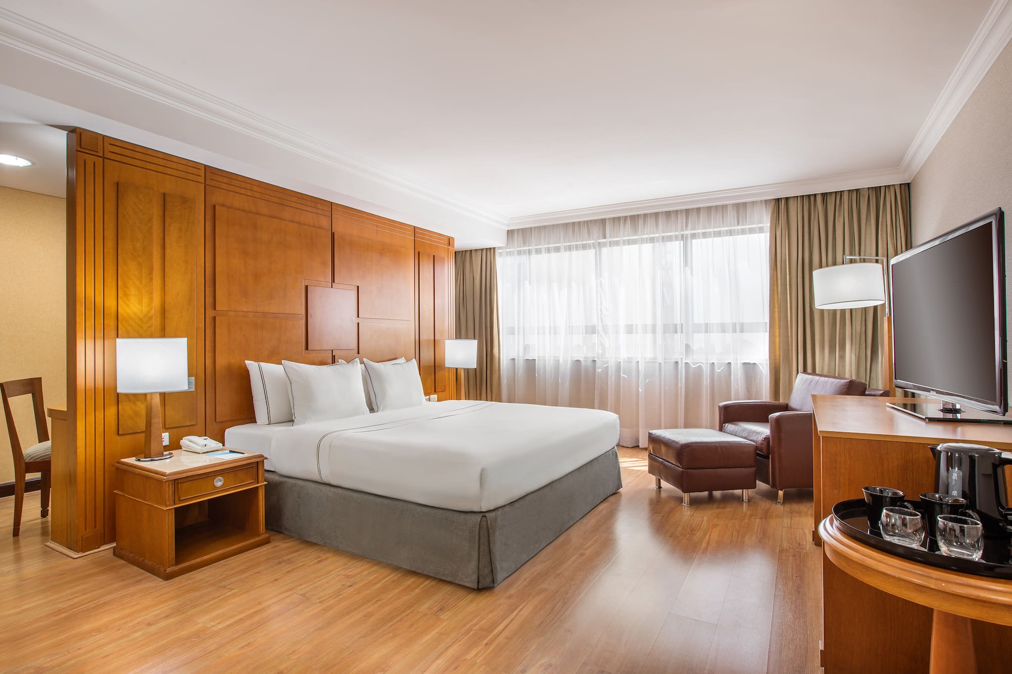 a room with a bed and a chair