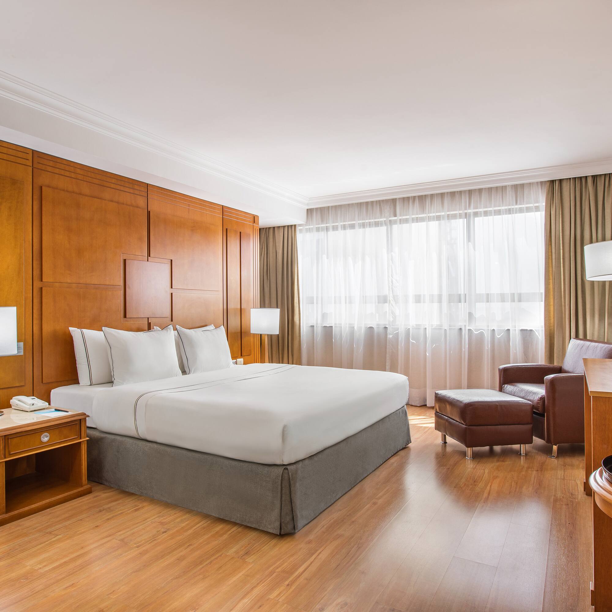 a room with a bed and a chair