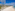 a beach with umbrellas and chairs