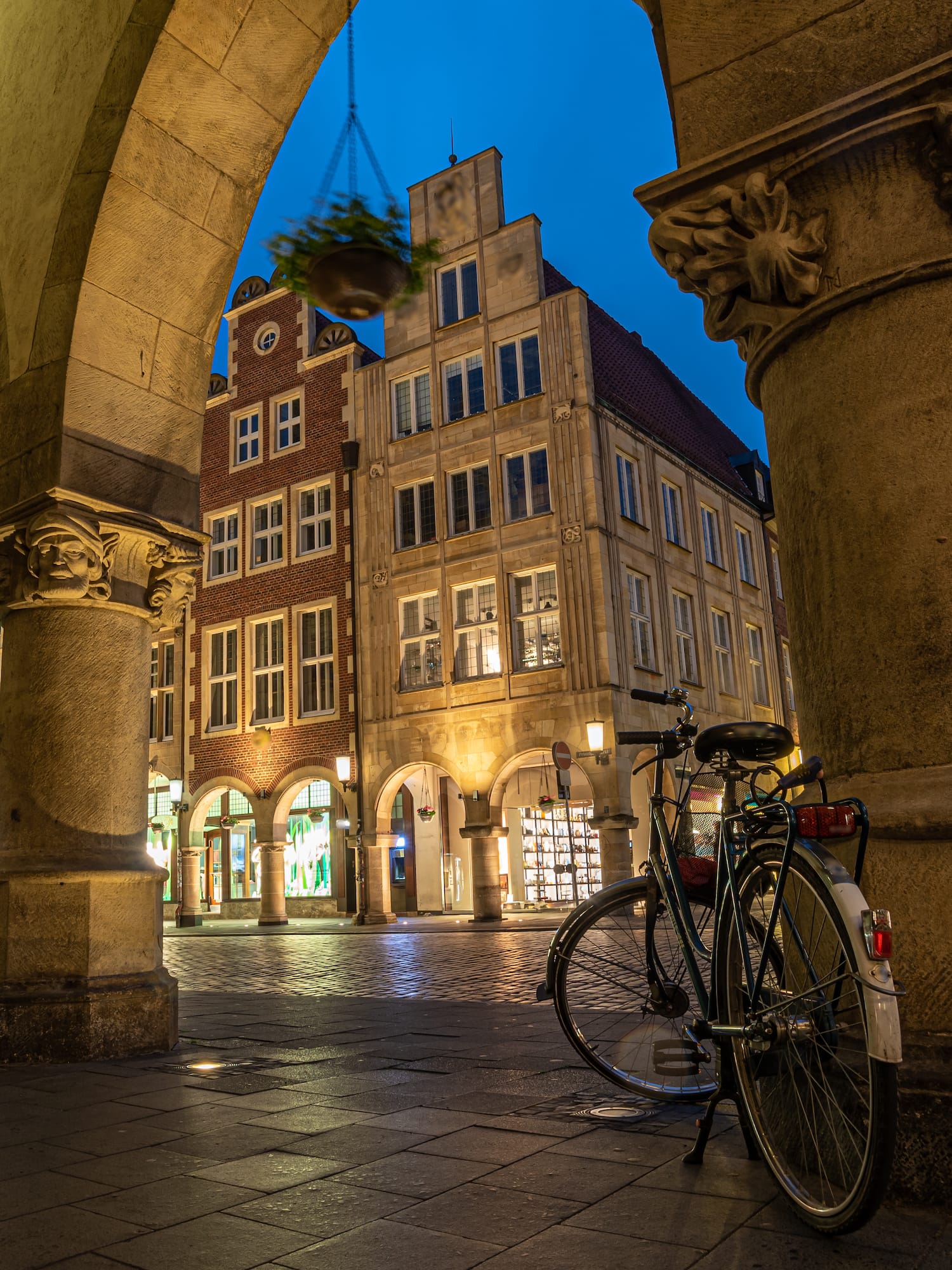 a bicycle parked on a sidewalk in front of a building