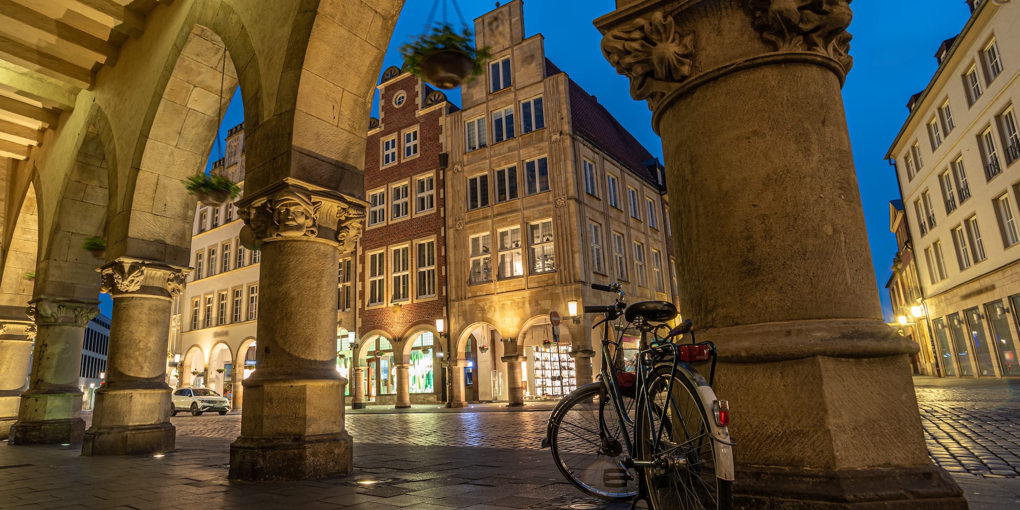 a bicycle parked on a sidewalk in front of a building