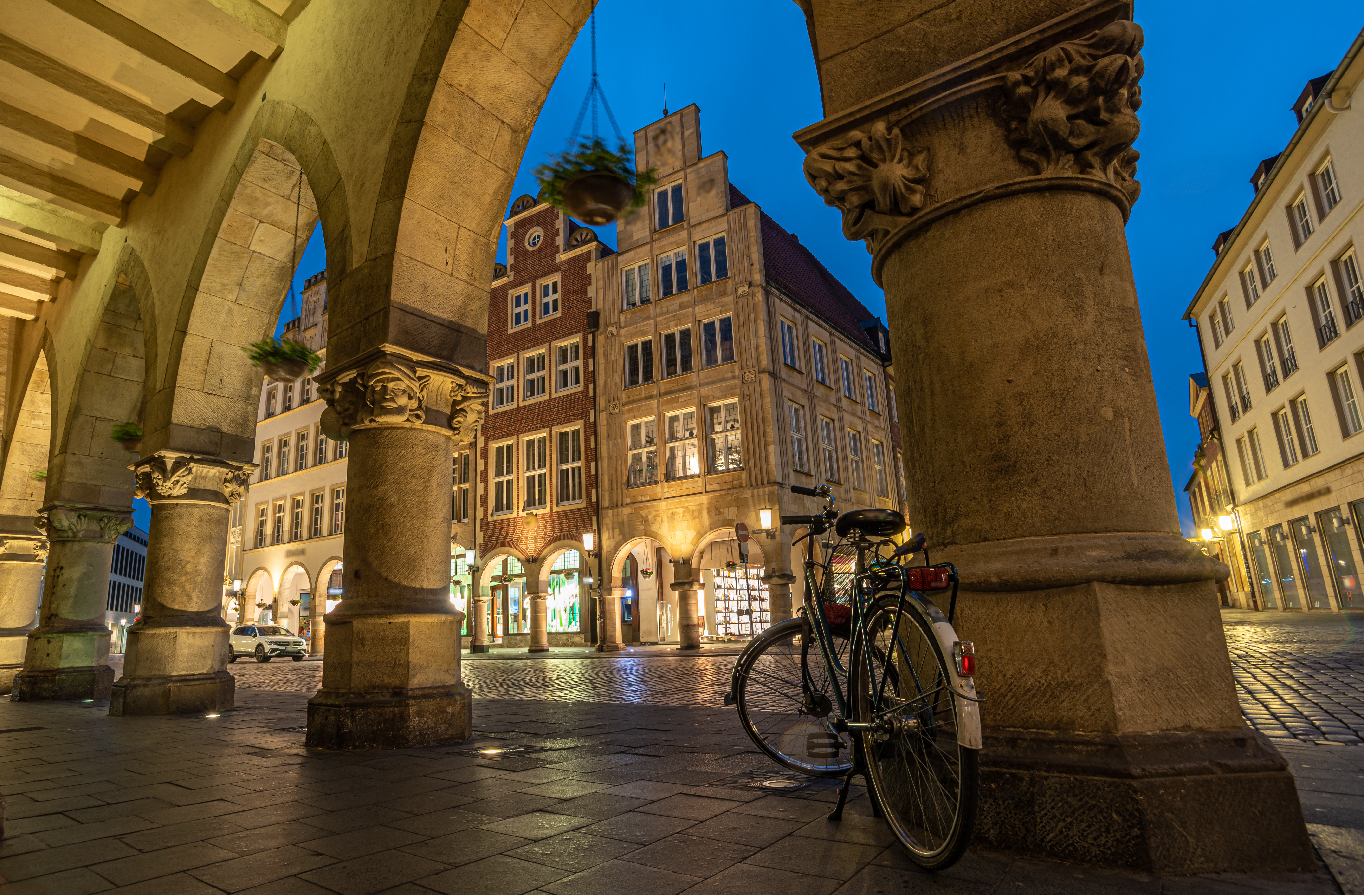 a bicycle parked on a sidewalk in front of a building