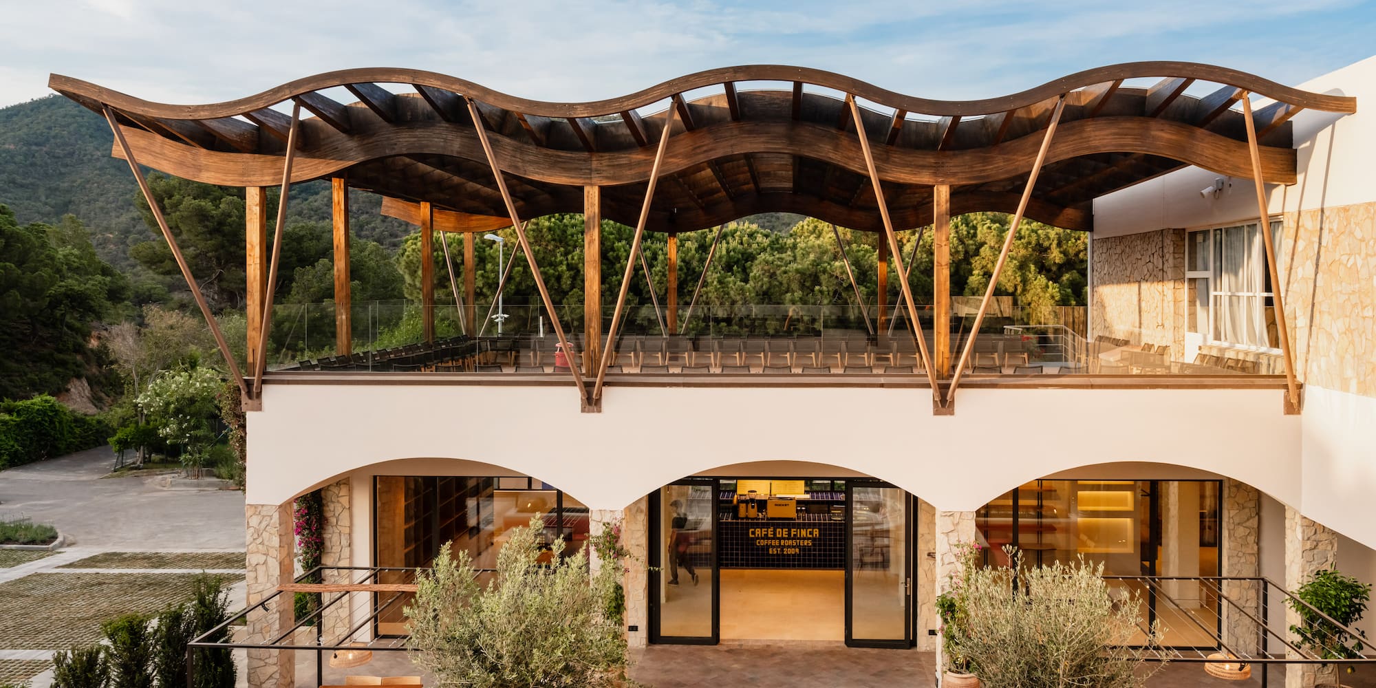 a building with a roof and chairs