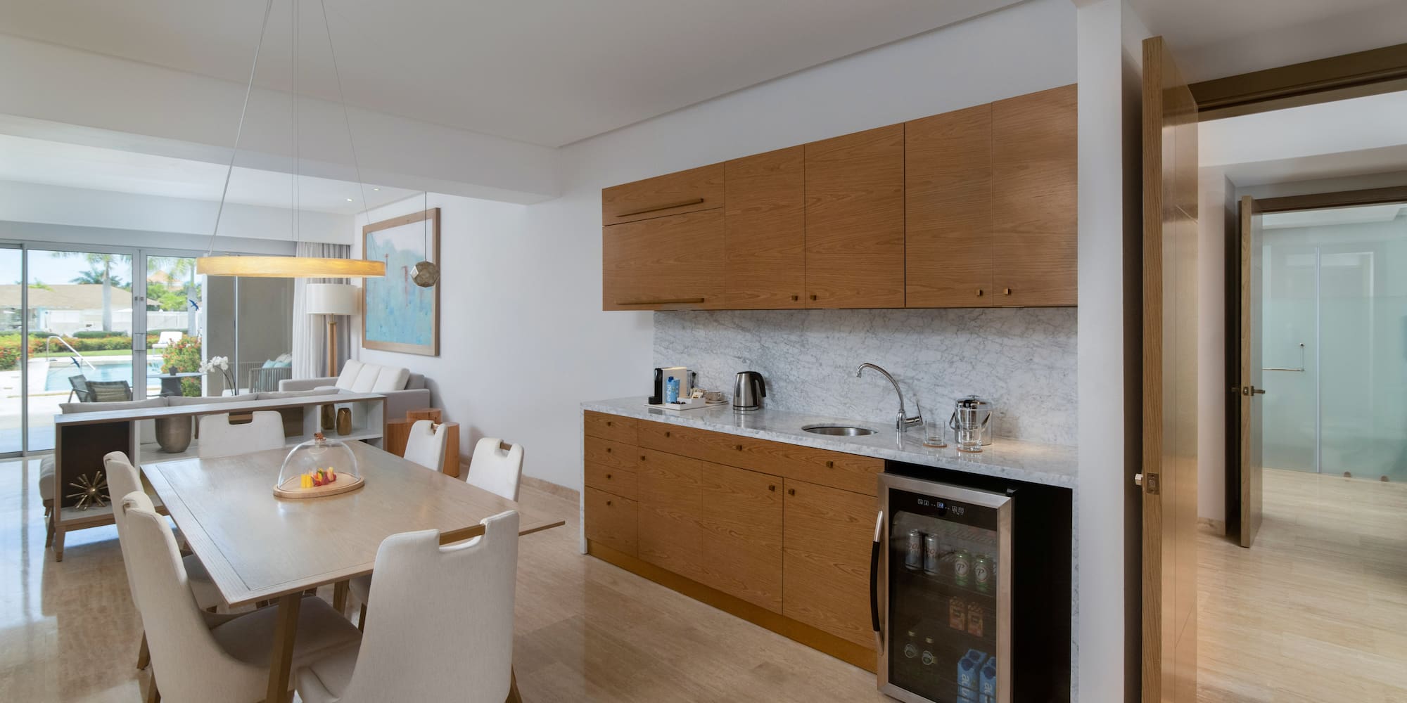 a kitchen with a table and chairs
