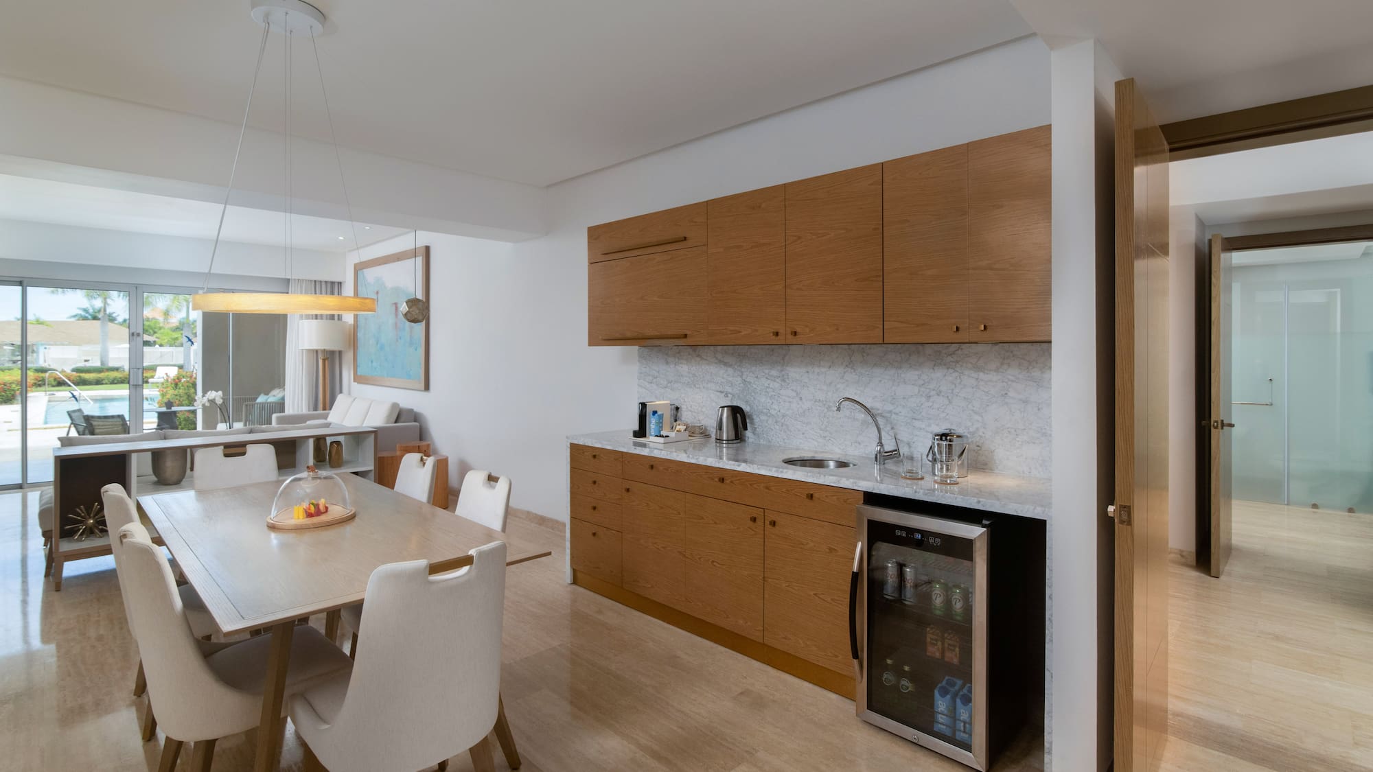 a kitchen with a table and chairs