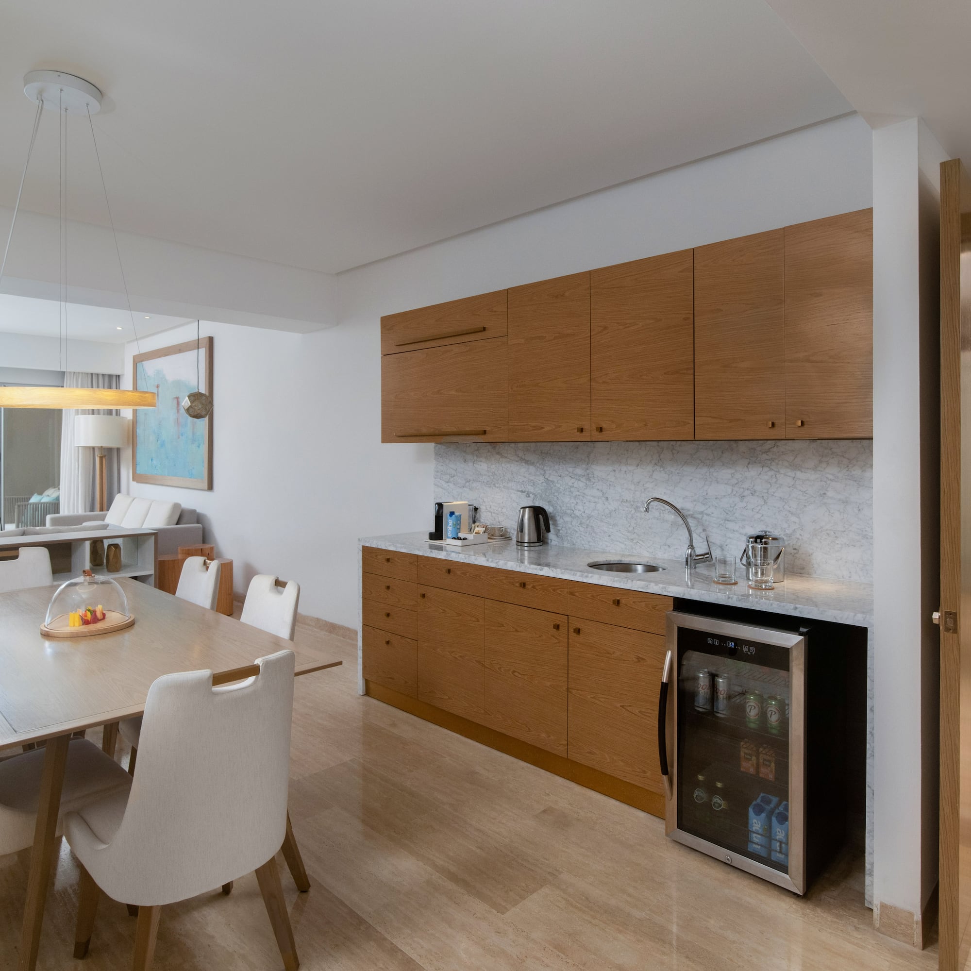 a kitchen with a table and chairs