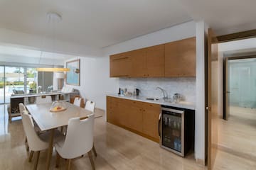 a kitchen with a table and chairs