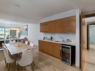 a kitchen with a table and chairs