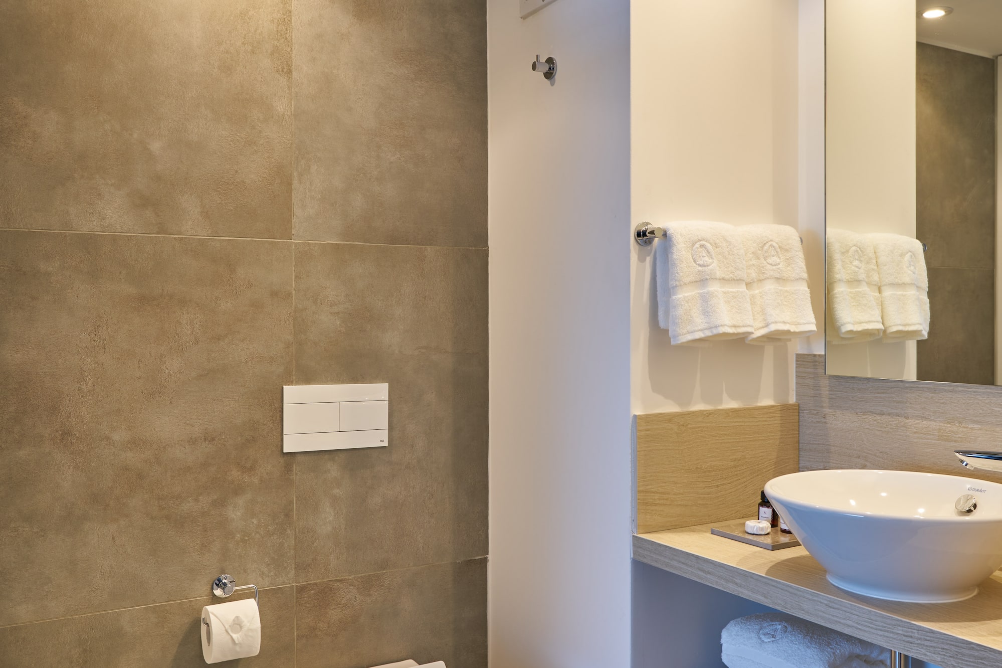 a bathroom with a sink and toilet