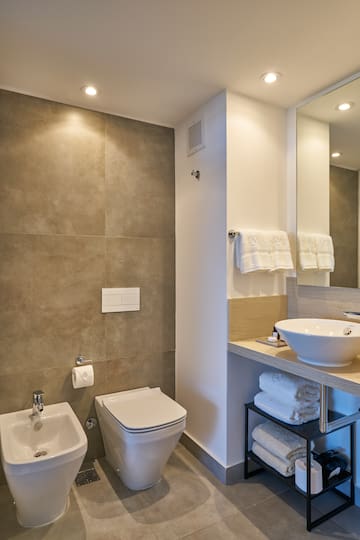 a bathroom with a sink and toilet