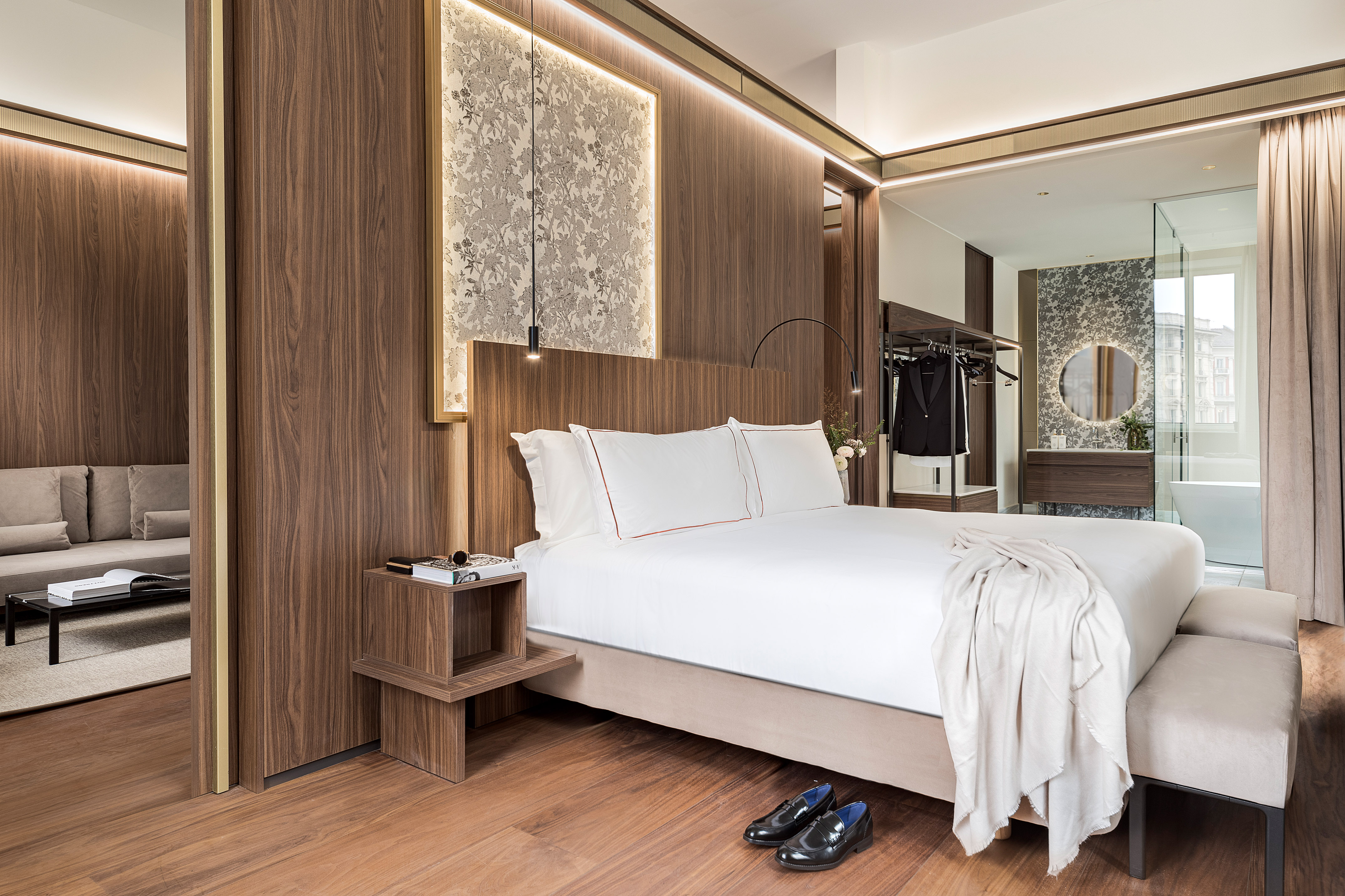 a bedroom with a bed and shoes on the floor