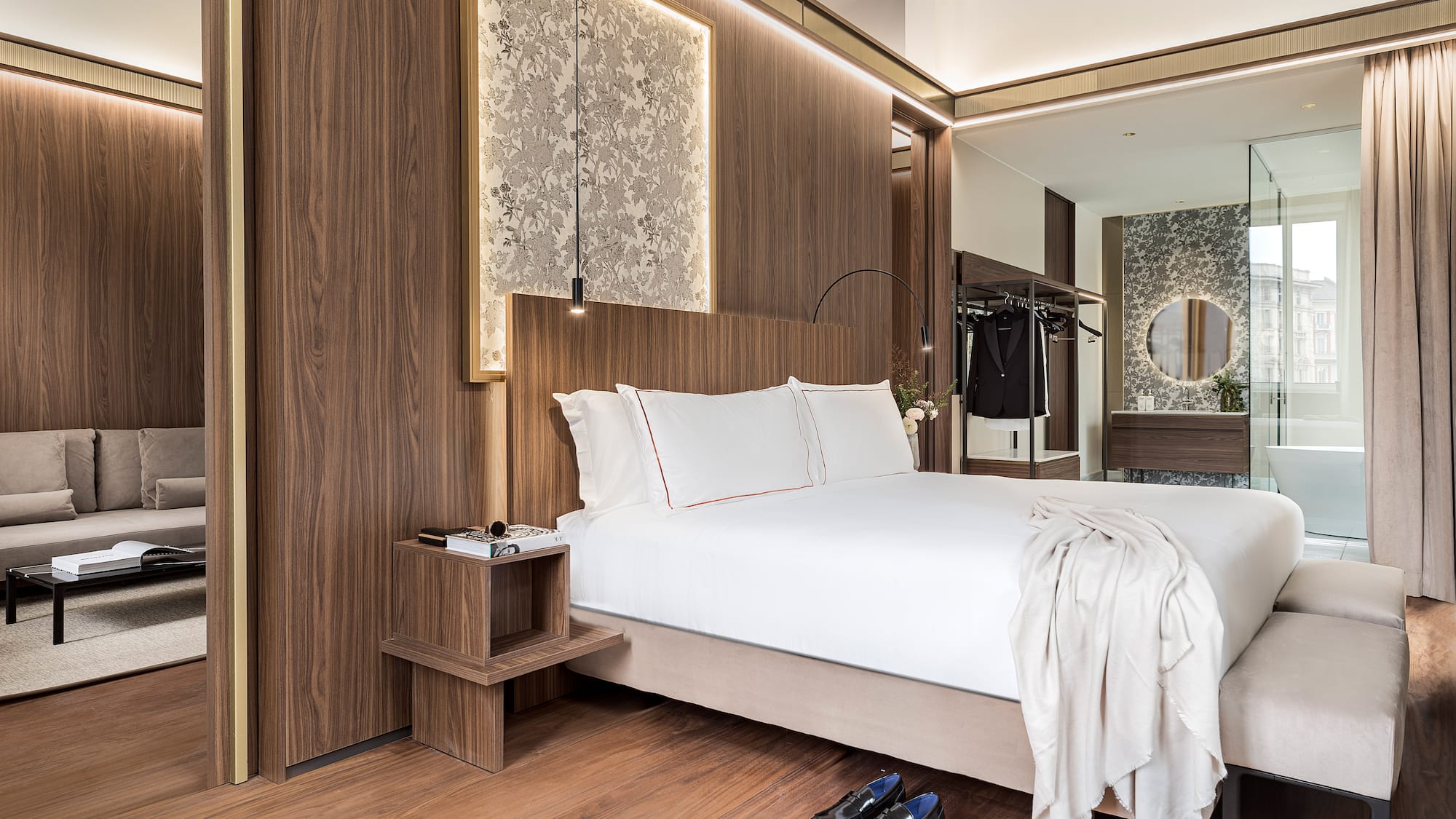 a bedroom with a bed and shoes on the floor