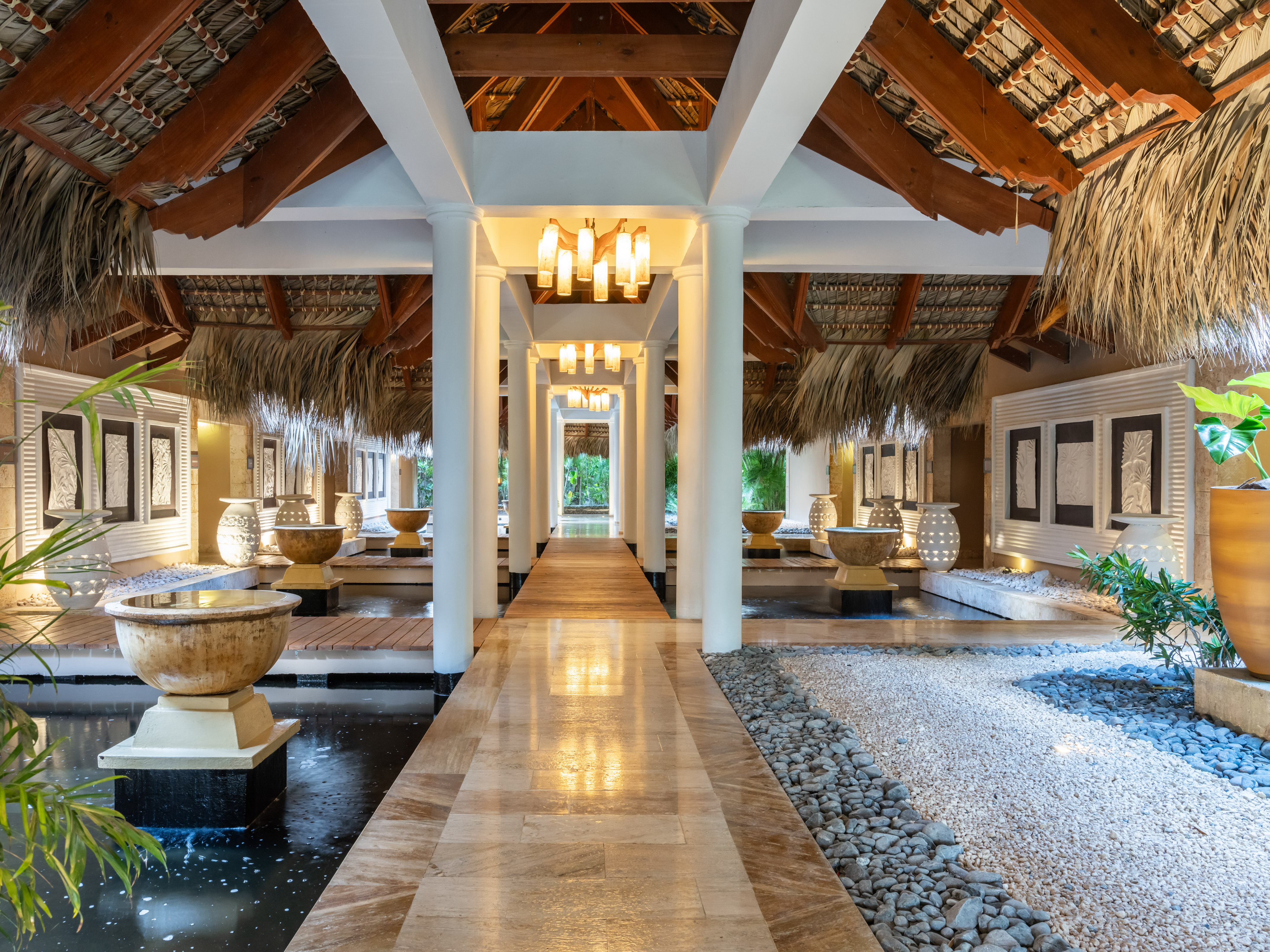 a building with a pond and a walkway