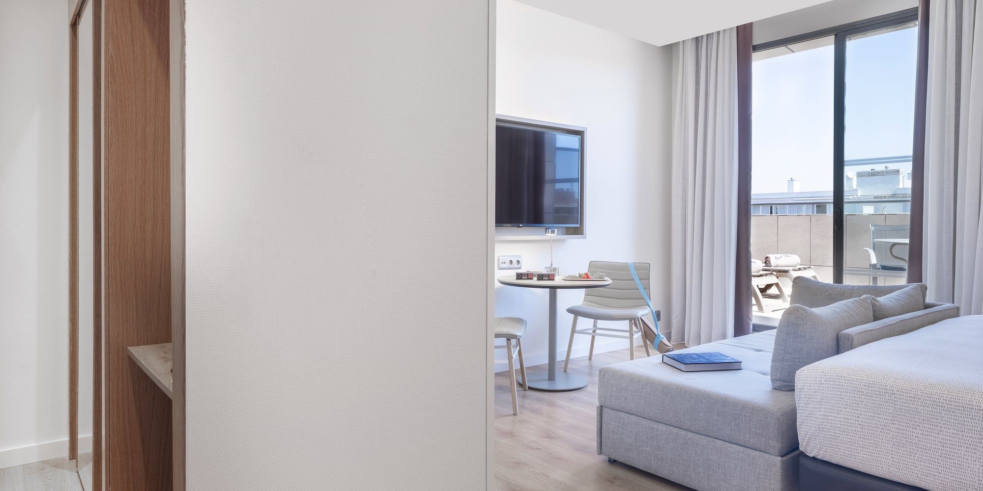 a room with a tv and couches