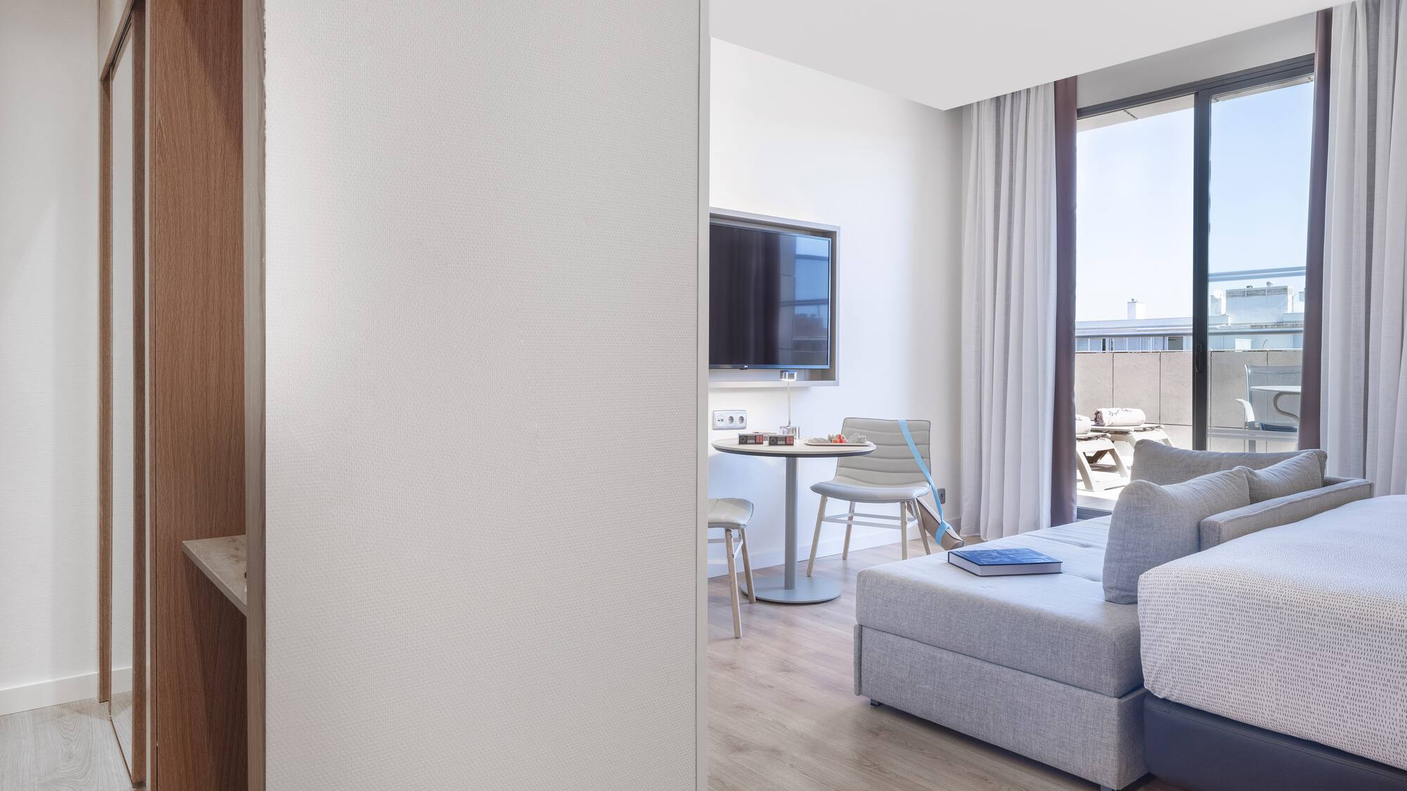 a room with a tv and couches