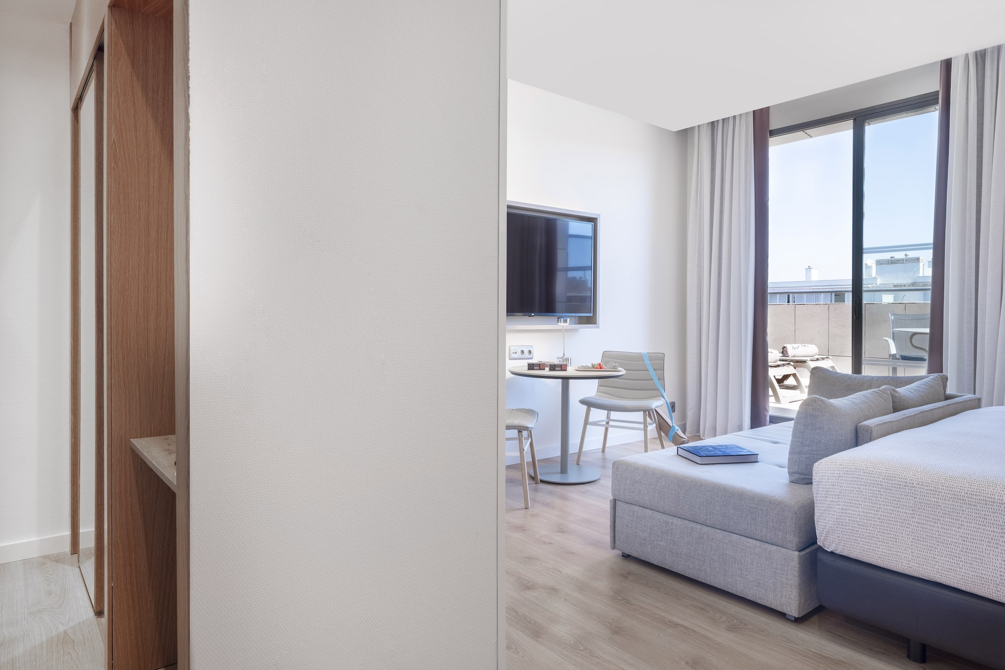 a room with a tv and couches