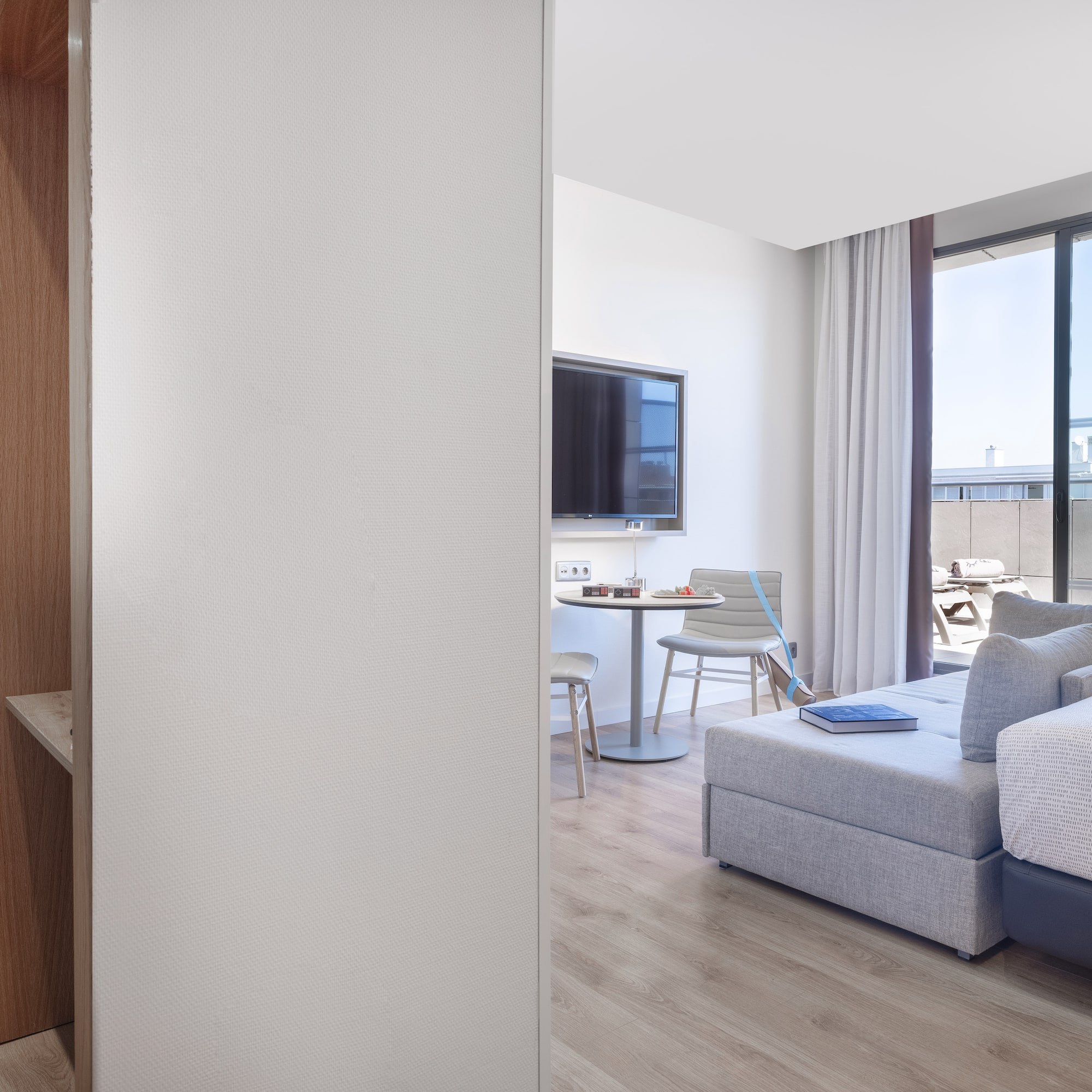 a room with a tv and couches