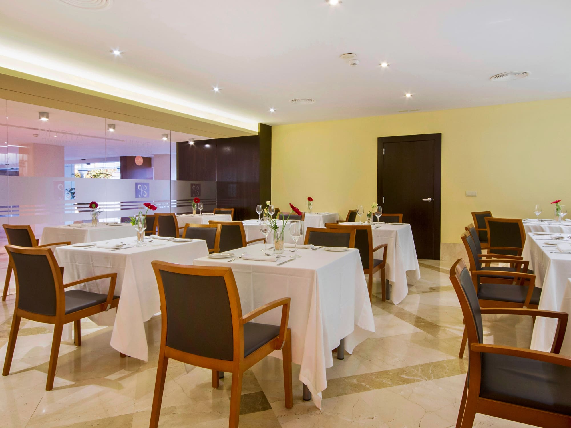 a room with tables and chairs