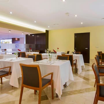 a room with tables and chairs