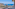 a balcony overlooking a city and the ocean