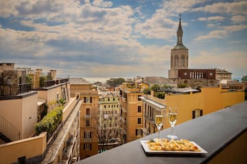 a plate of food on a table with a glass of champagne