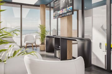 a room with a television and a large window