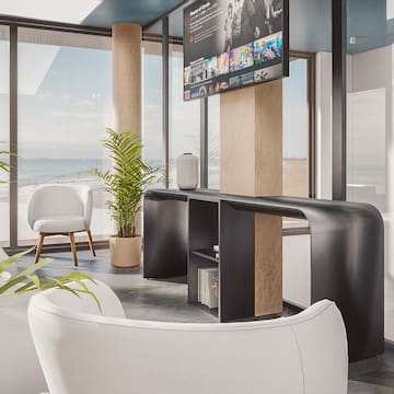 a room with a television and a large window