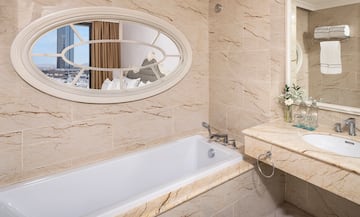 a bathroom with a bathtub and a sink