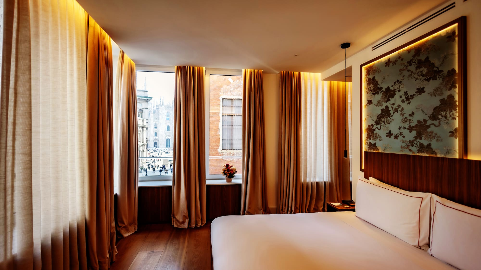 a room with a bed and curtains