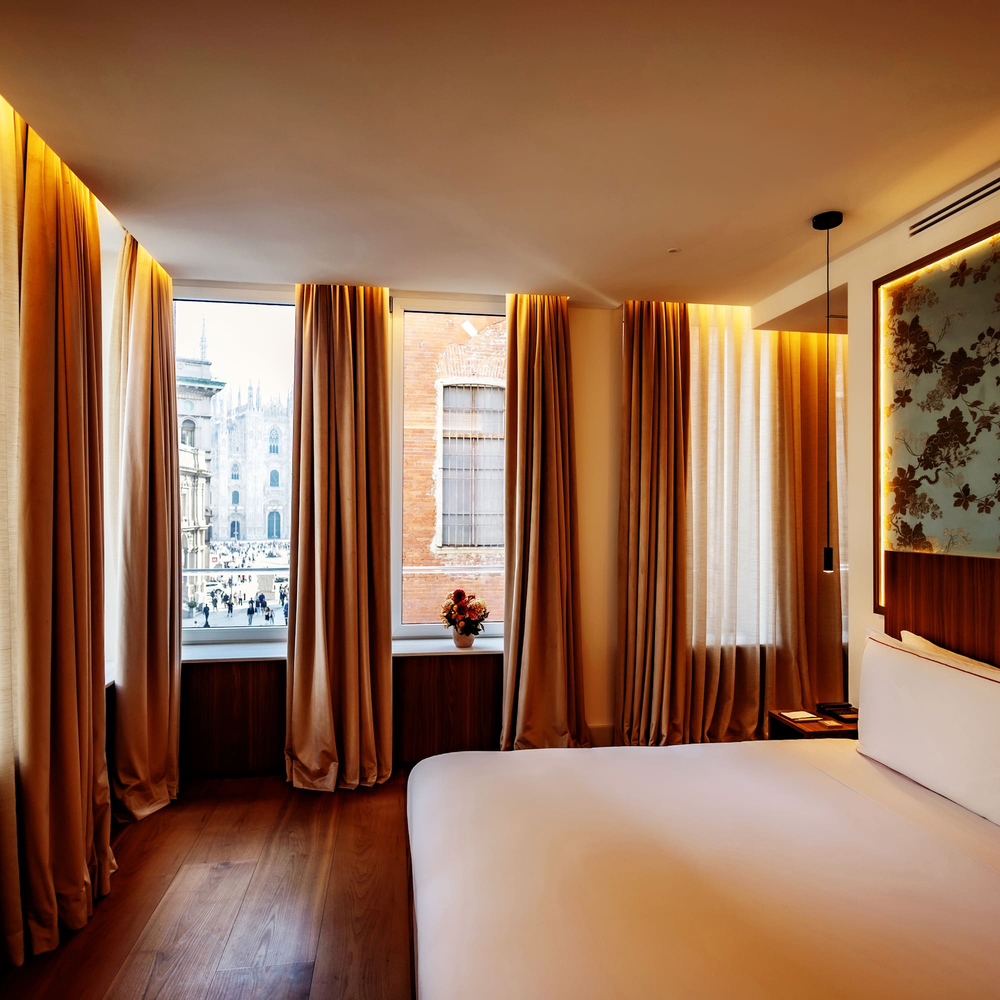 a room with a bed and curtains