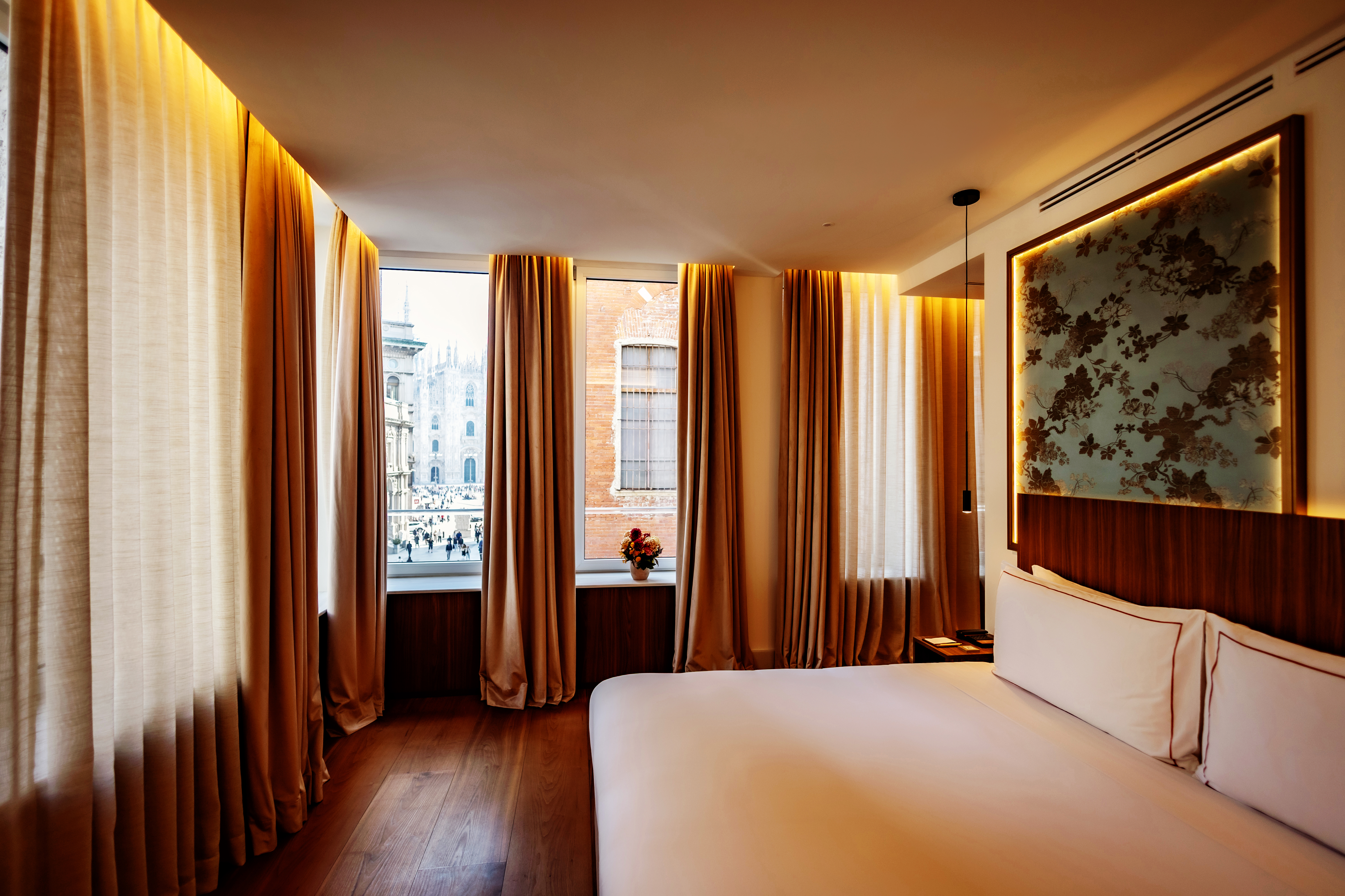 a room with a bed and curtains