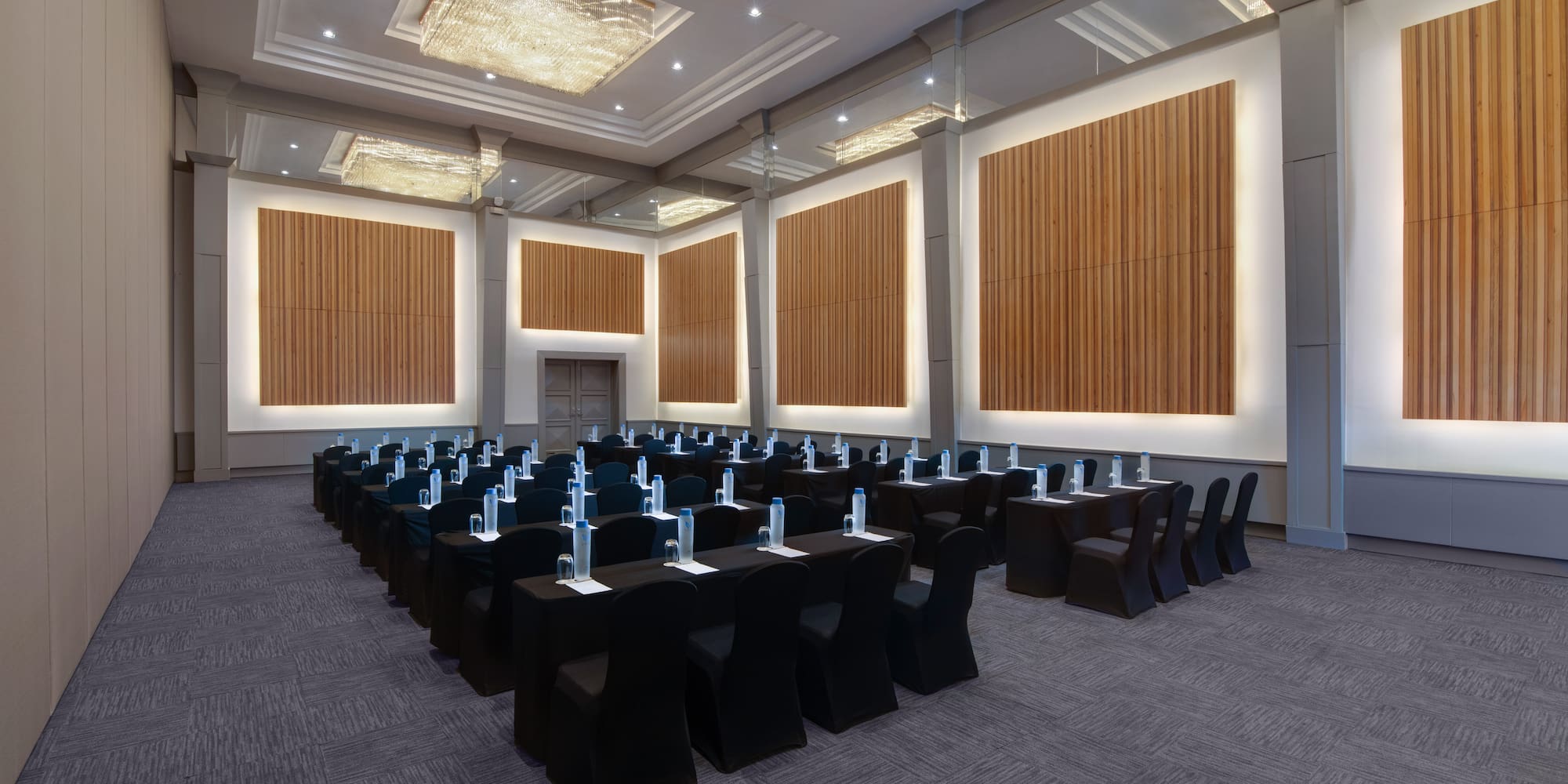 a room with black chairs and tables