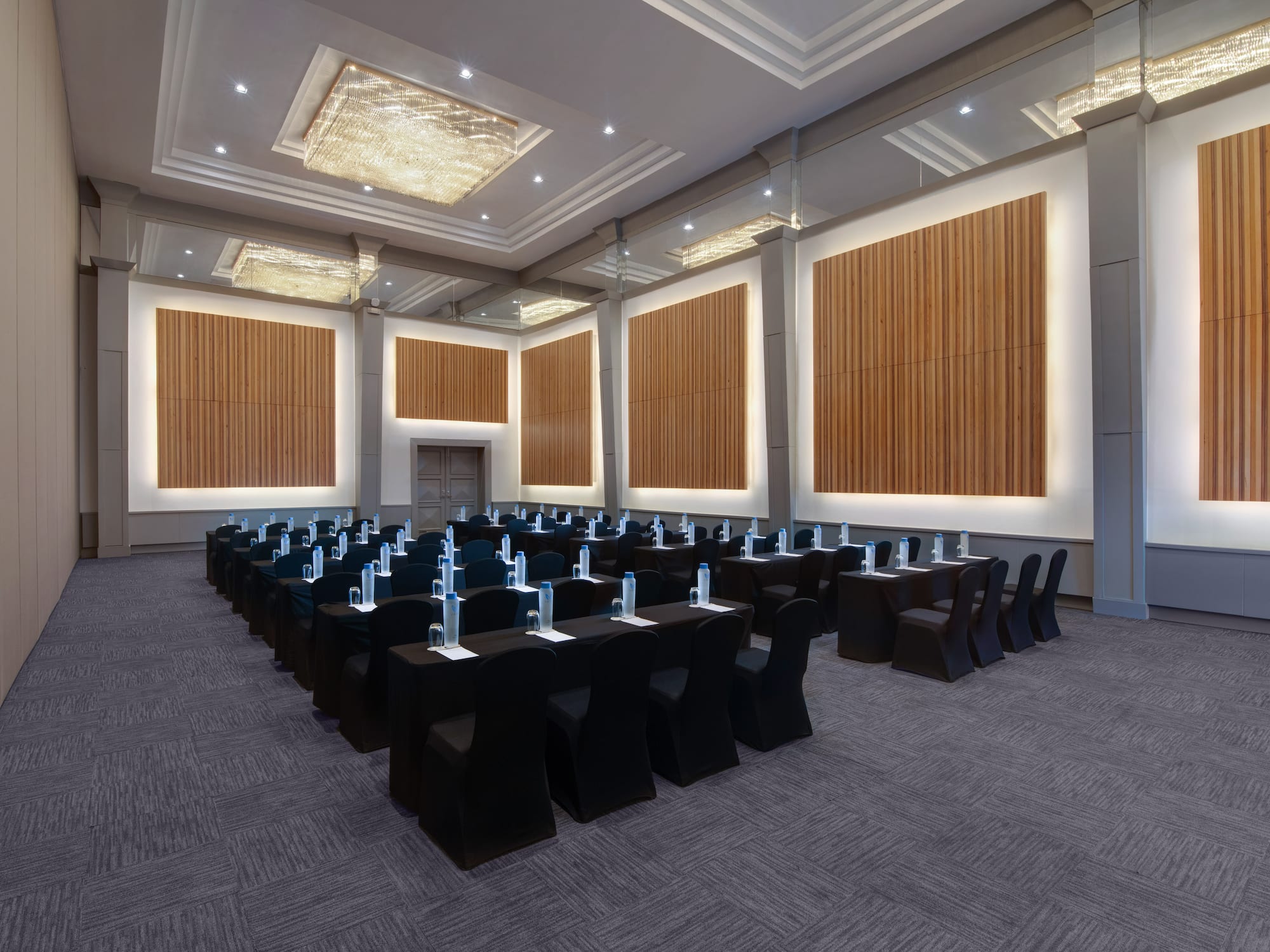 a room with black chairs and tables