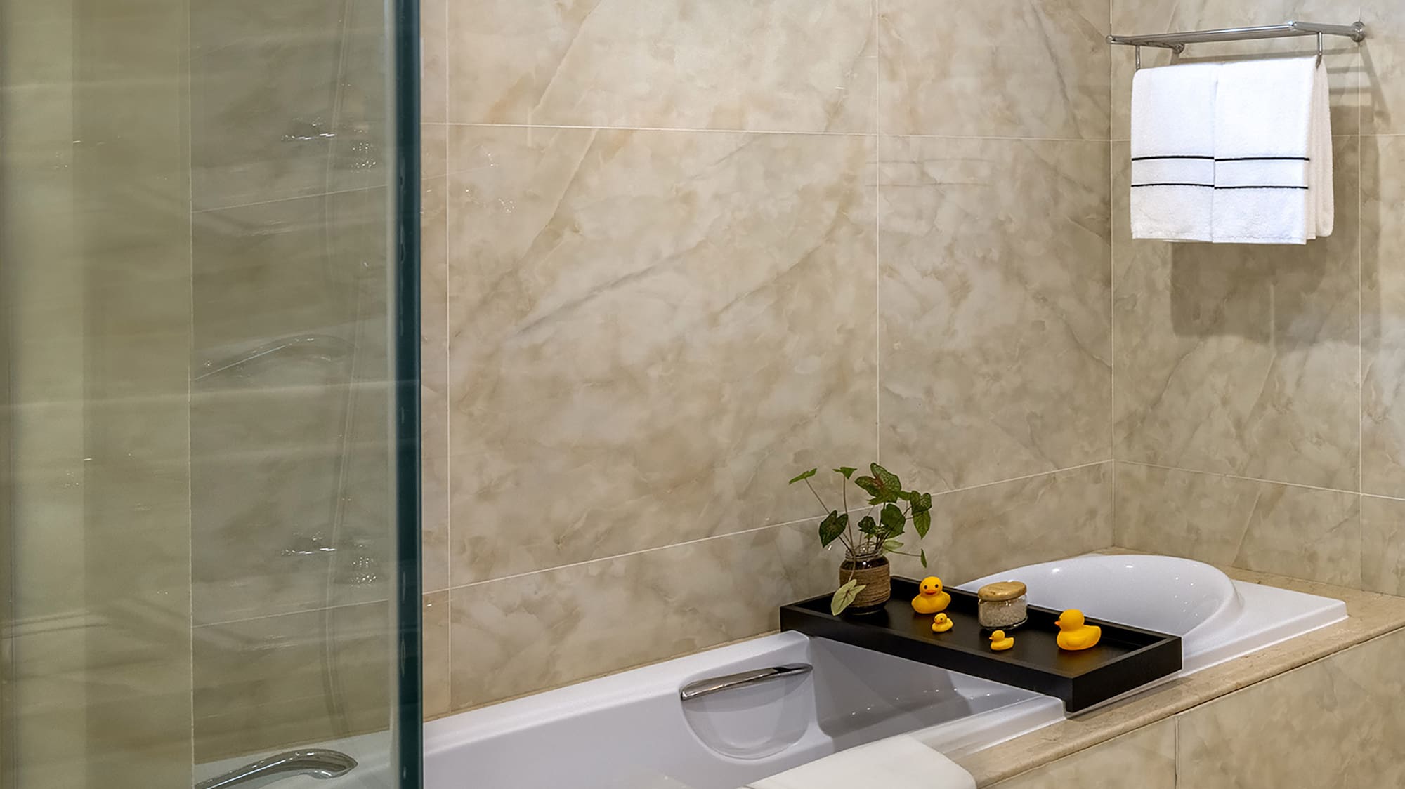 a bathroom with a glass shower door