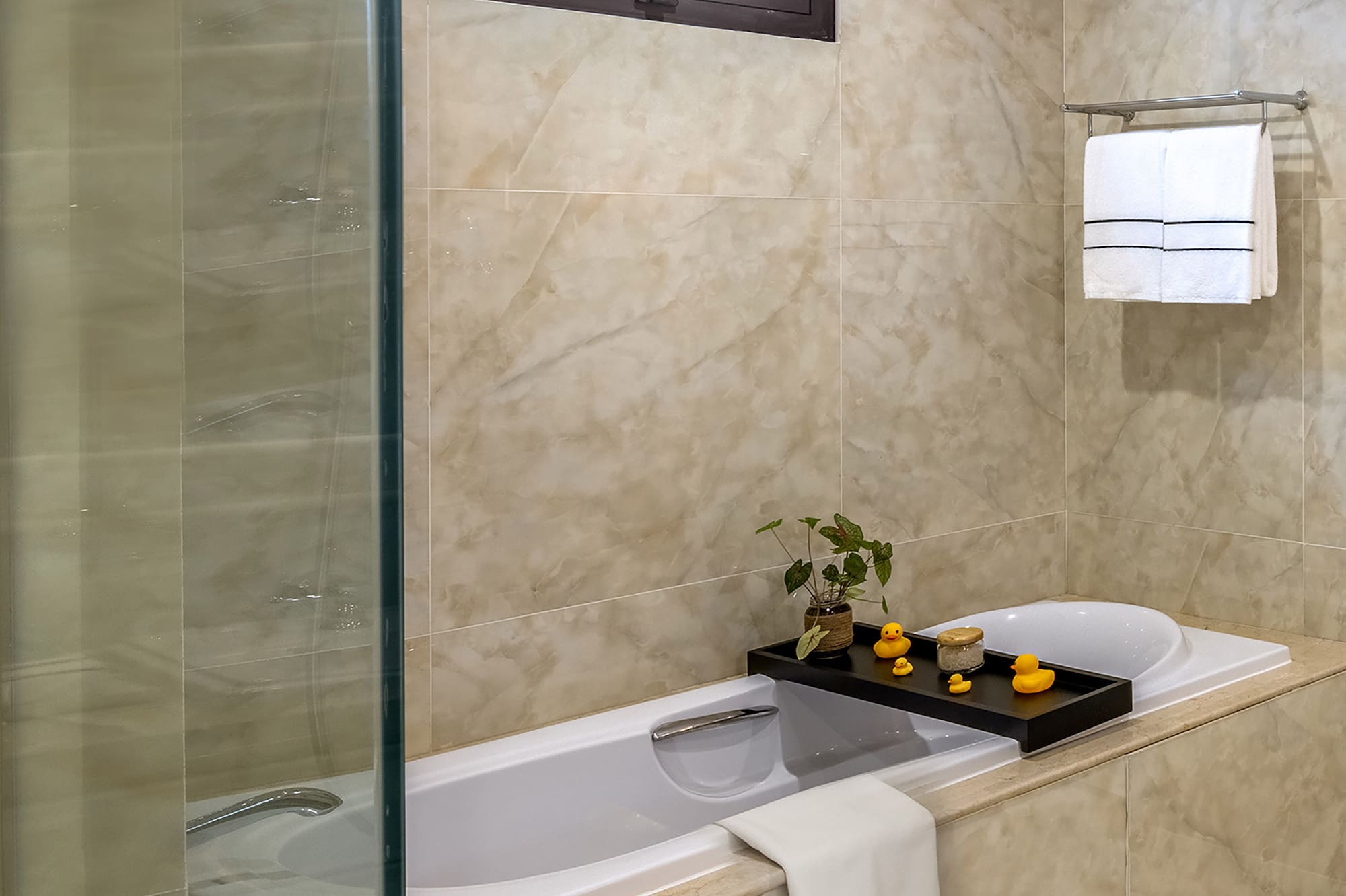 a bathroom with a glass shower door