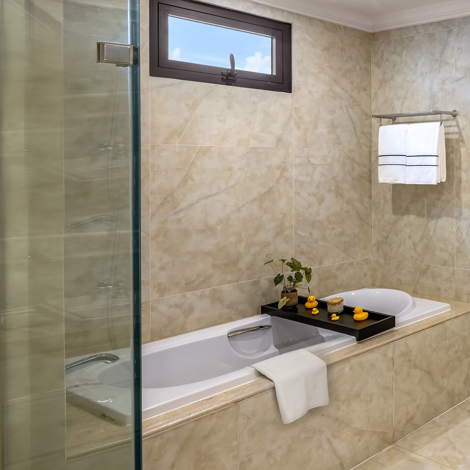 a bathroom with a glass shower door