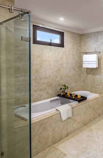 a bathroom with a glass shower door