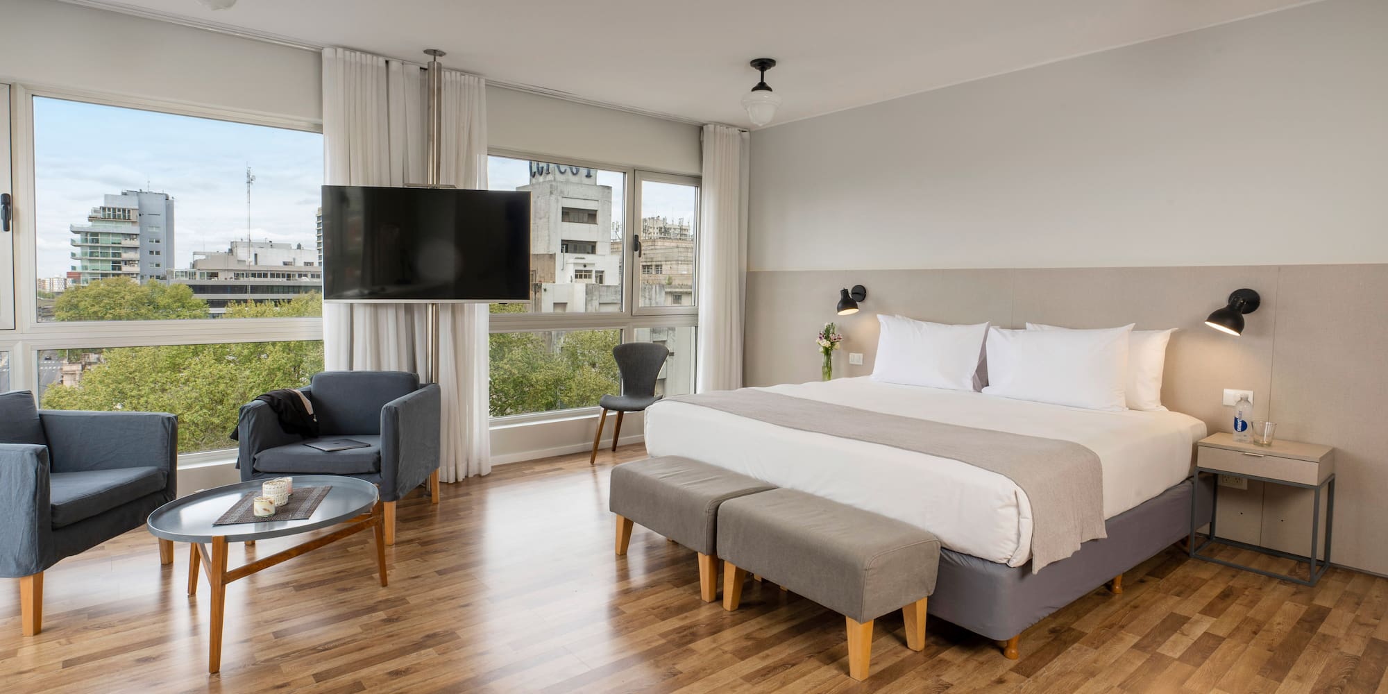 a bedroom with a large bed and a television