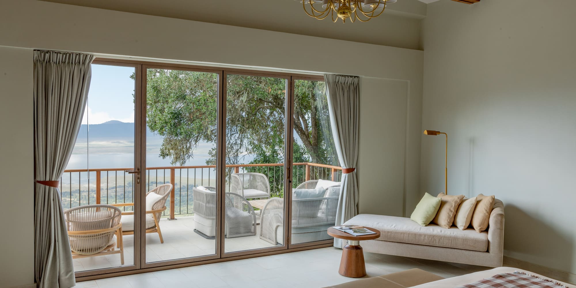 a room with a couch and a glass door