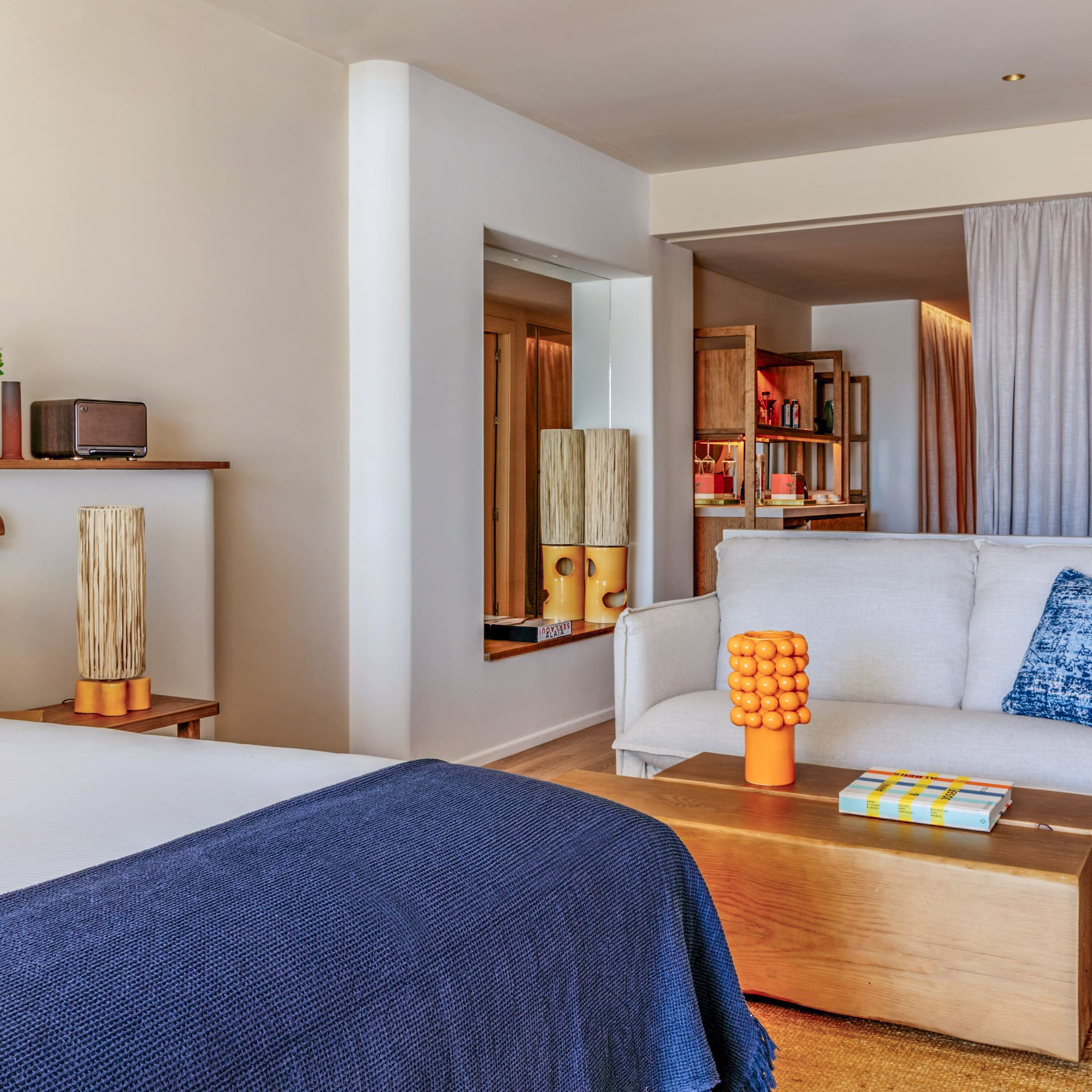 a room with a bed and couch