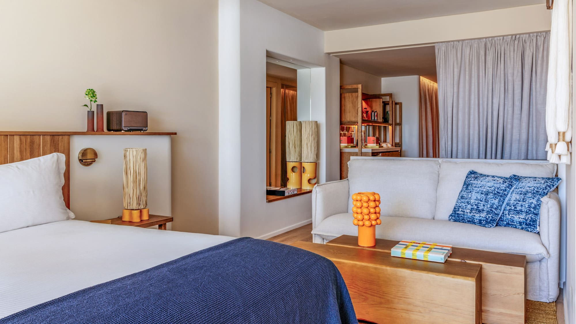 a room with a bed and couch