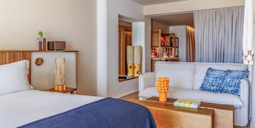 a room with a bed and couch