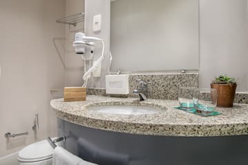 a bathroom with a marble counter top