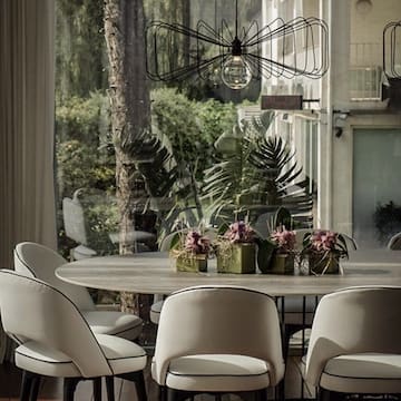 a dining table with chairs and a chandelier