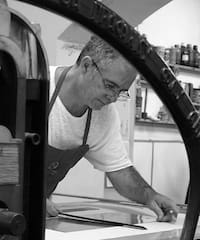 a man working on a piece of paper