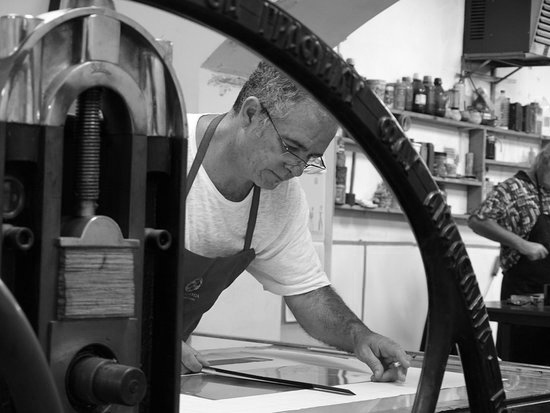 a man working on a piece of paper