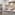 Compact white kitchenette with sink, stove, fridge, microwave, toaster, and kettle.