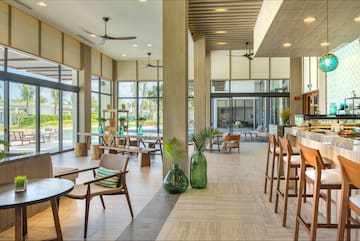 a room with a large glass wall and a large window